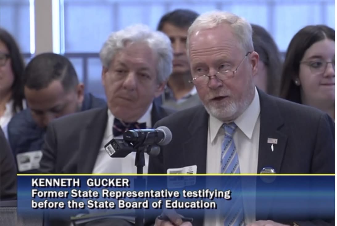 Ken Gucker testifying before the Board of Education